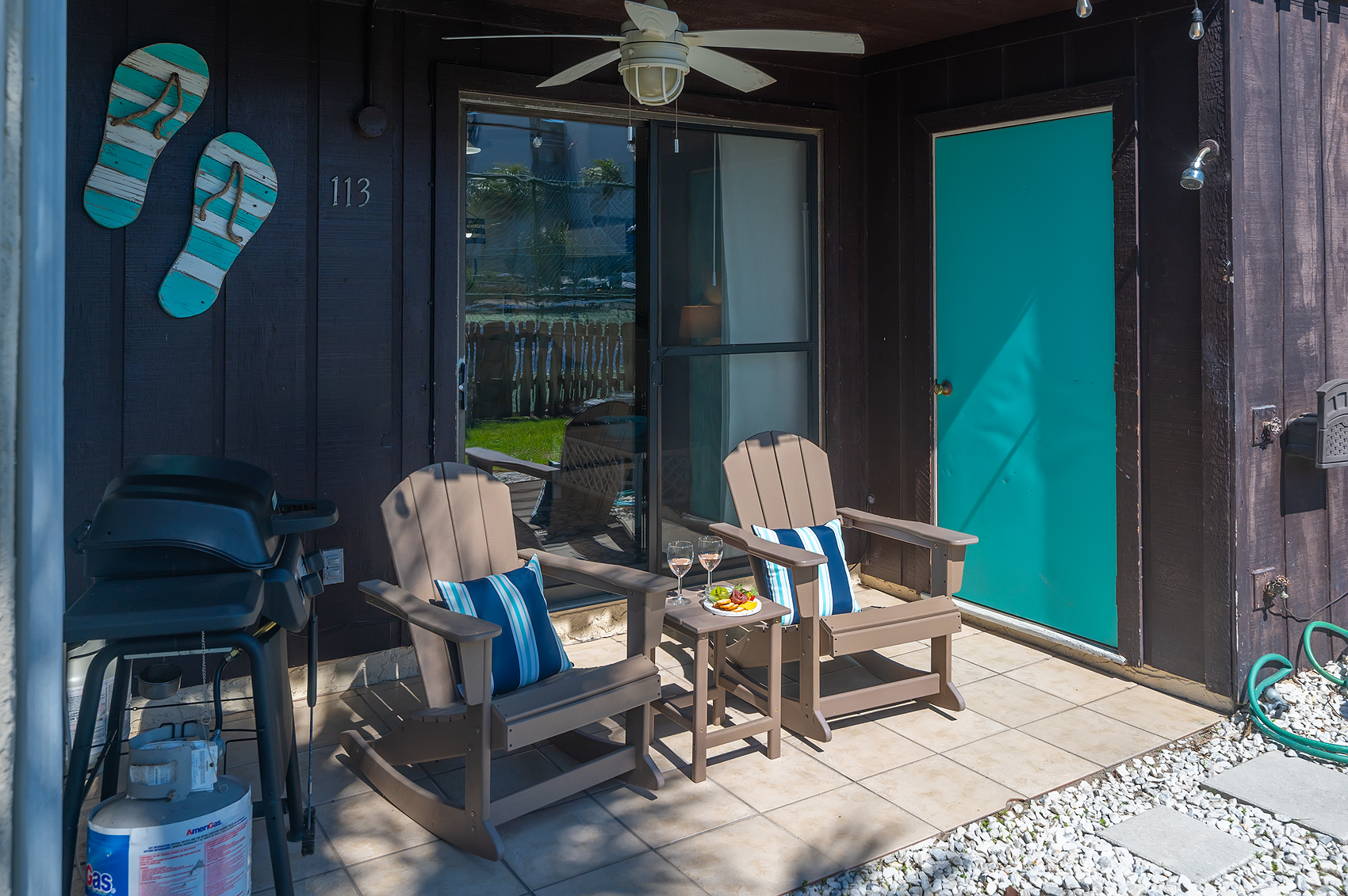 Community pool from the side — clear turquoise water